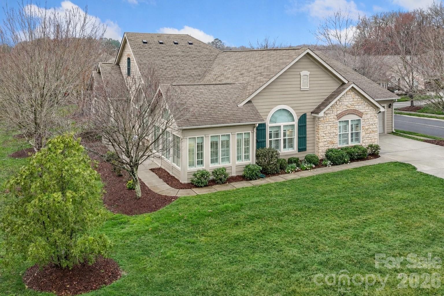 2444 Coltsview Lane Matthews, NC 28105 - Photo 2 of 43 a front view of a house with garden