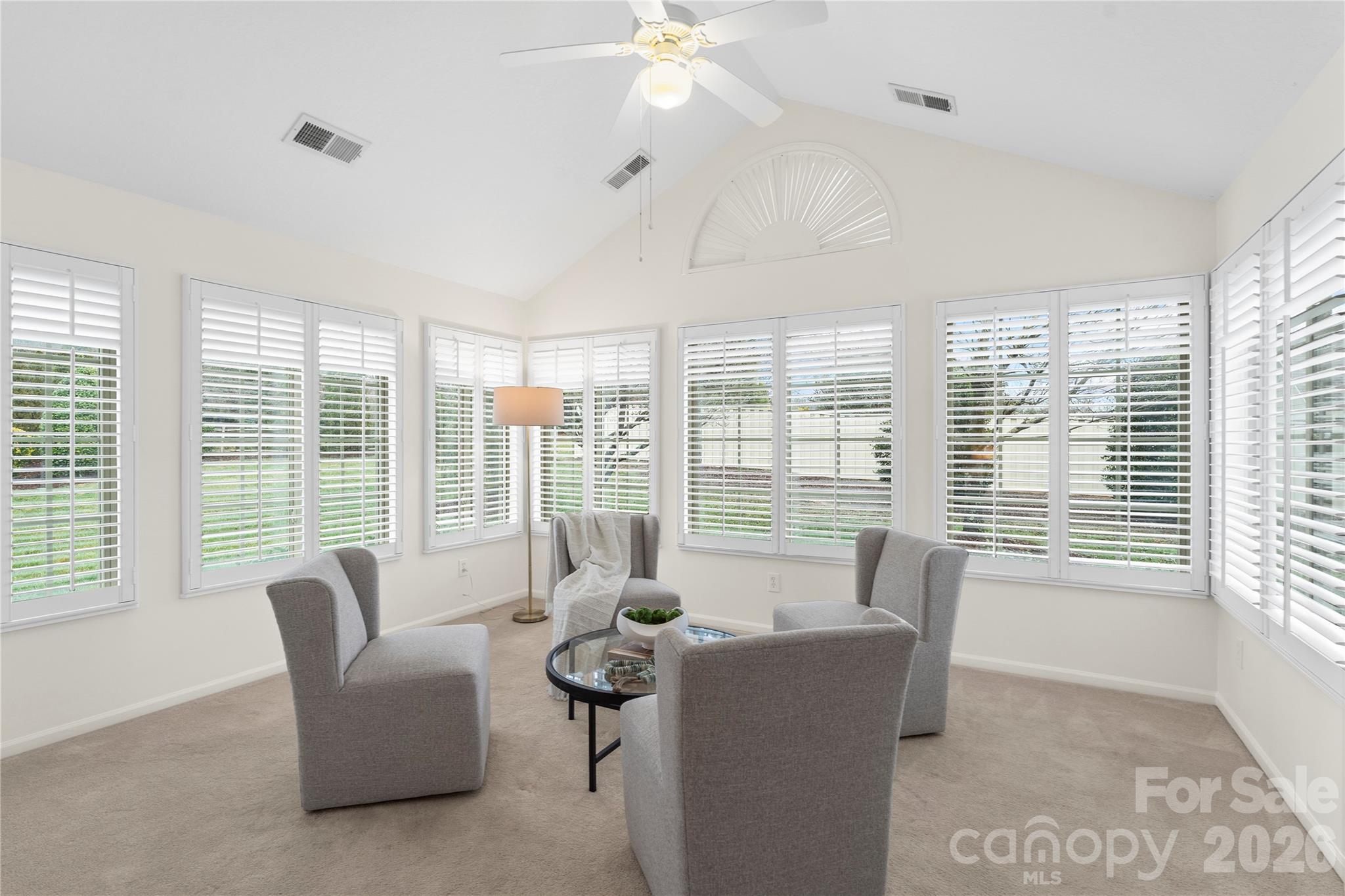 2444 Coltsview Lane Matthews, NC 28105 - Photo 25 of 43 a living room with furniture and large windows