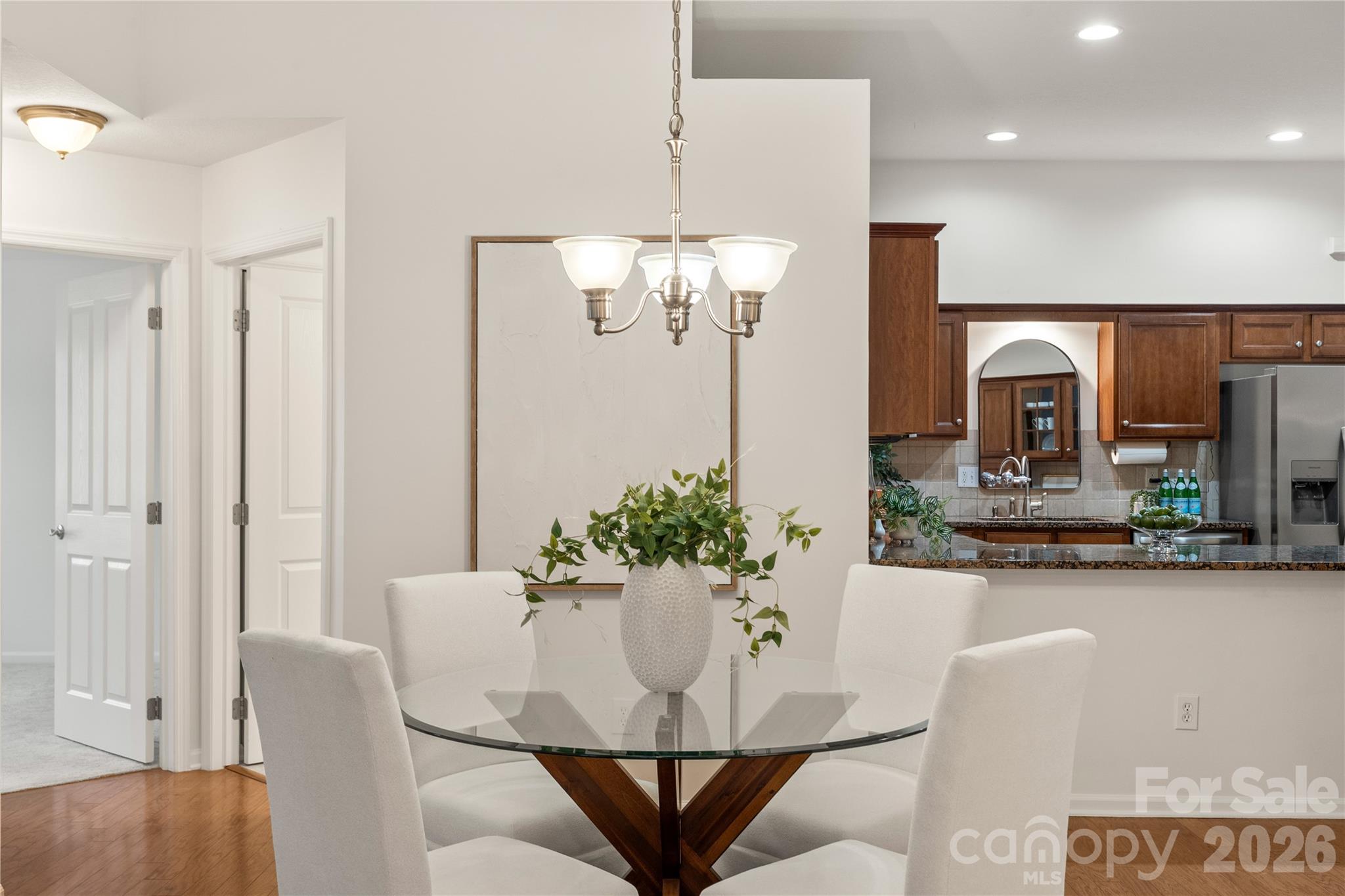 2444 Coltsview Lane Matthews, NC 28105 - Photo 26 of 43 a view of a dining room with furniture and chandelier