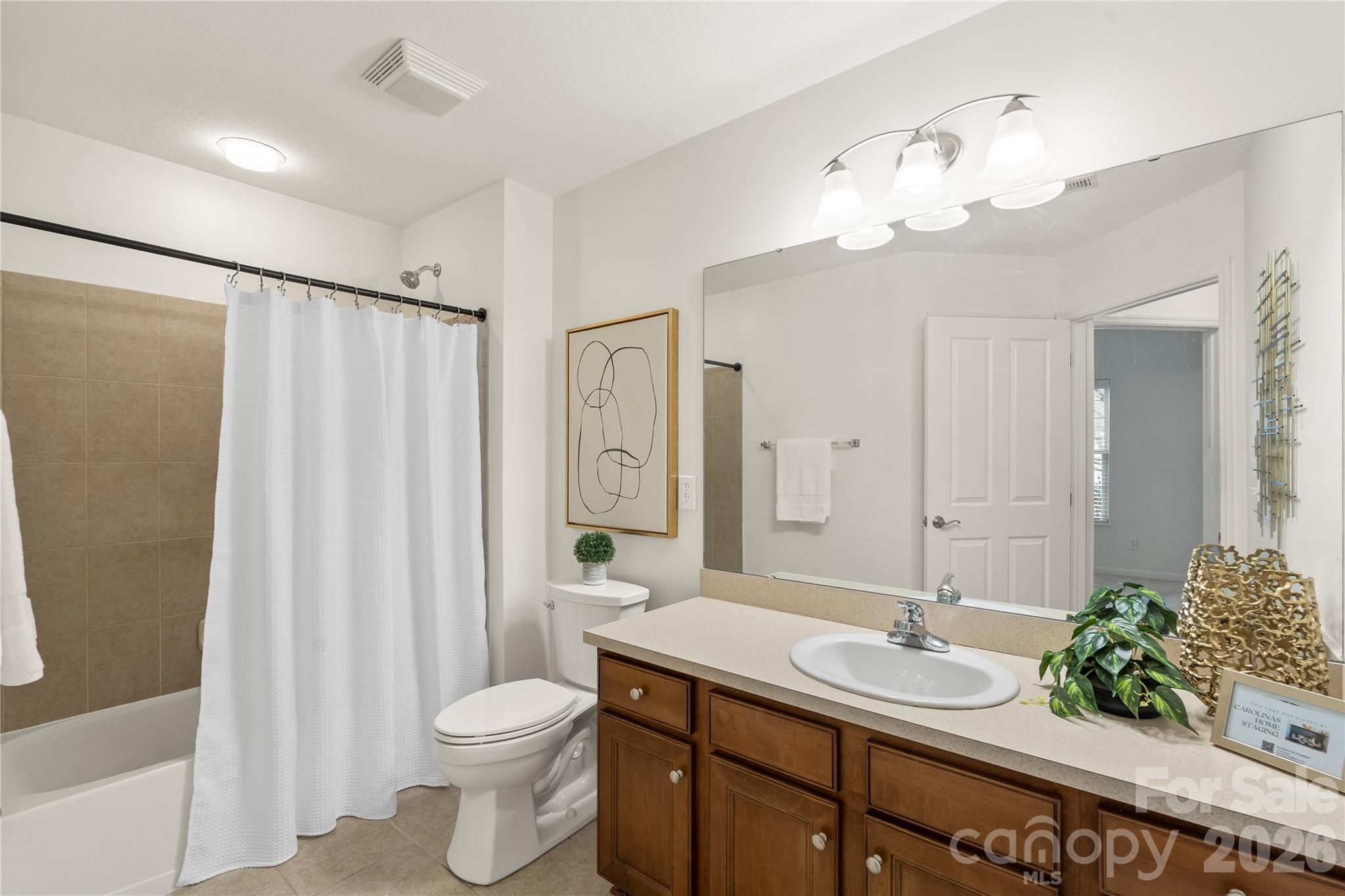 2444 Coltsview Lane Matthews, NC 28105 - Photo 29 of 43 a bathroom with a granite countertop sink toilet and shower