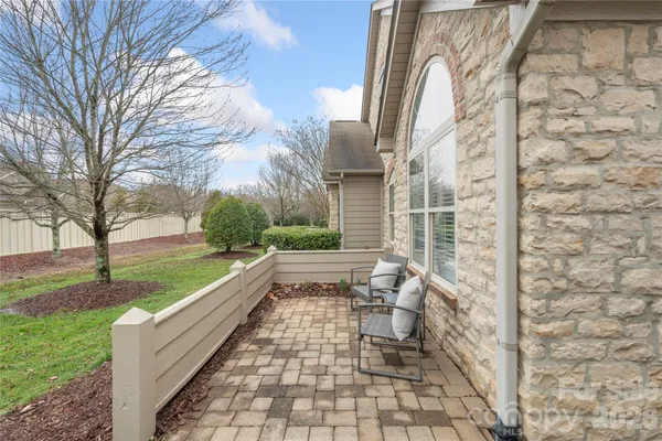 a view of a patio with a yard