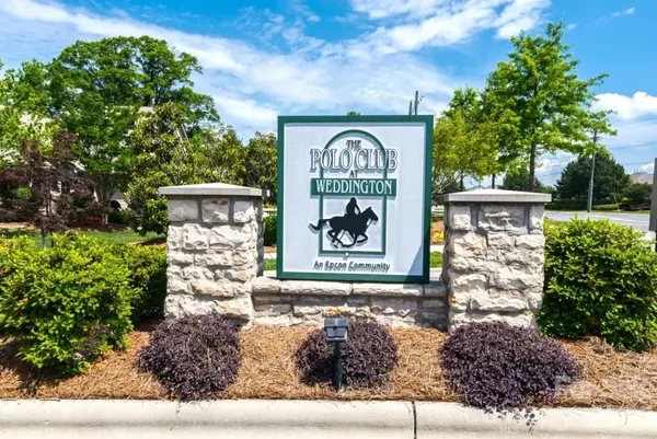 an aerial view of a house with outdoor space