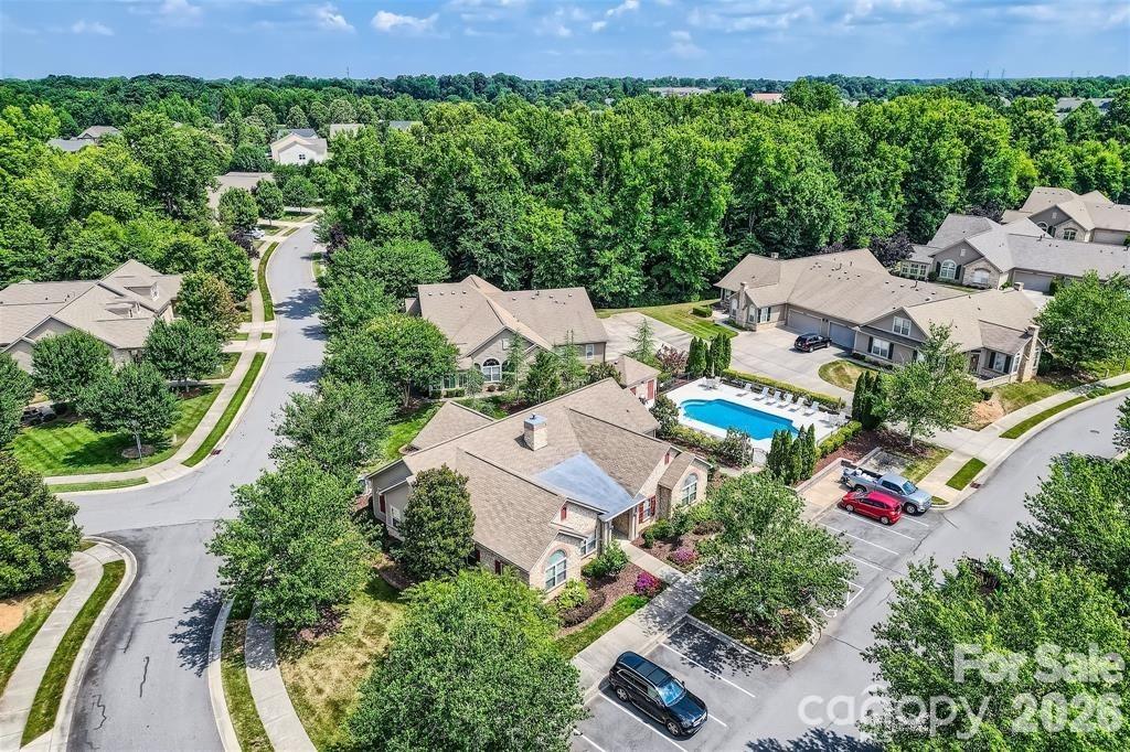 2444 Coltsview Lane Matthews, NC 28105 - Photo 38 of 43 an aerial view of a house with swimming pool and outdoor space
