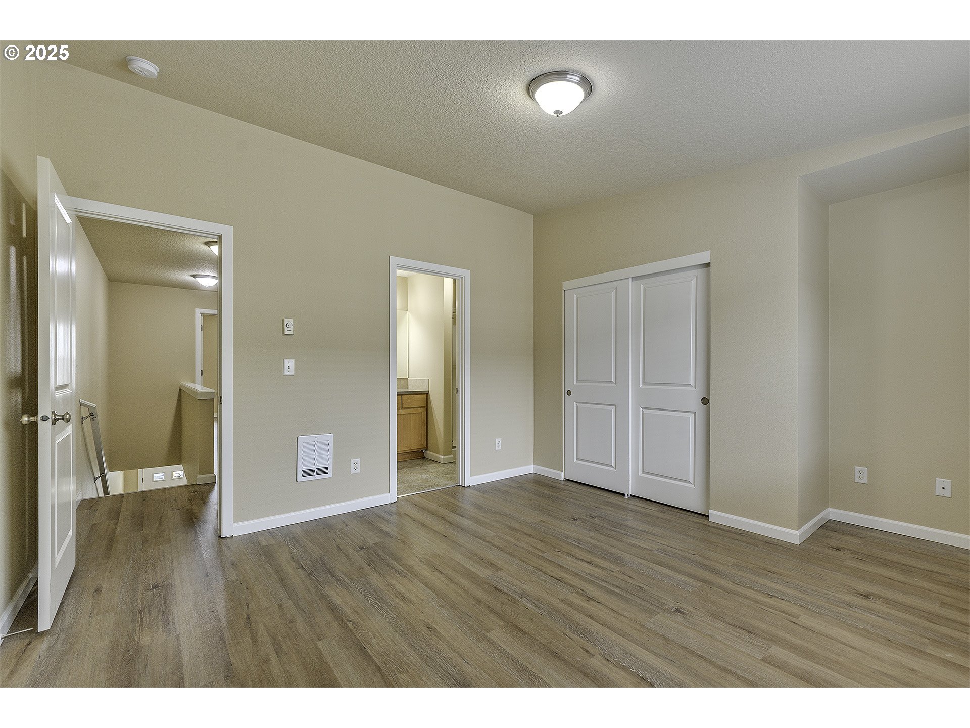 18483 Southwest Annamae Lane Beaverton, OR 97003 - Photo 16 of 23 a view of an empty room and wooden floor