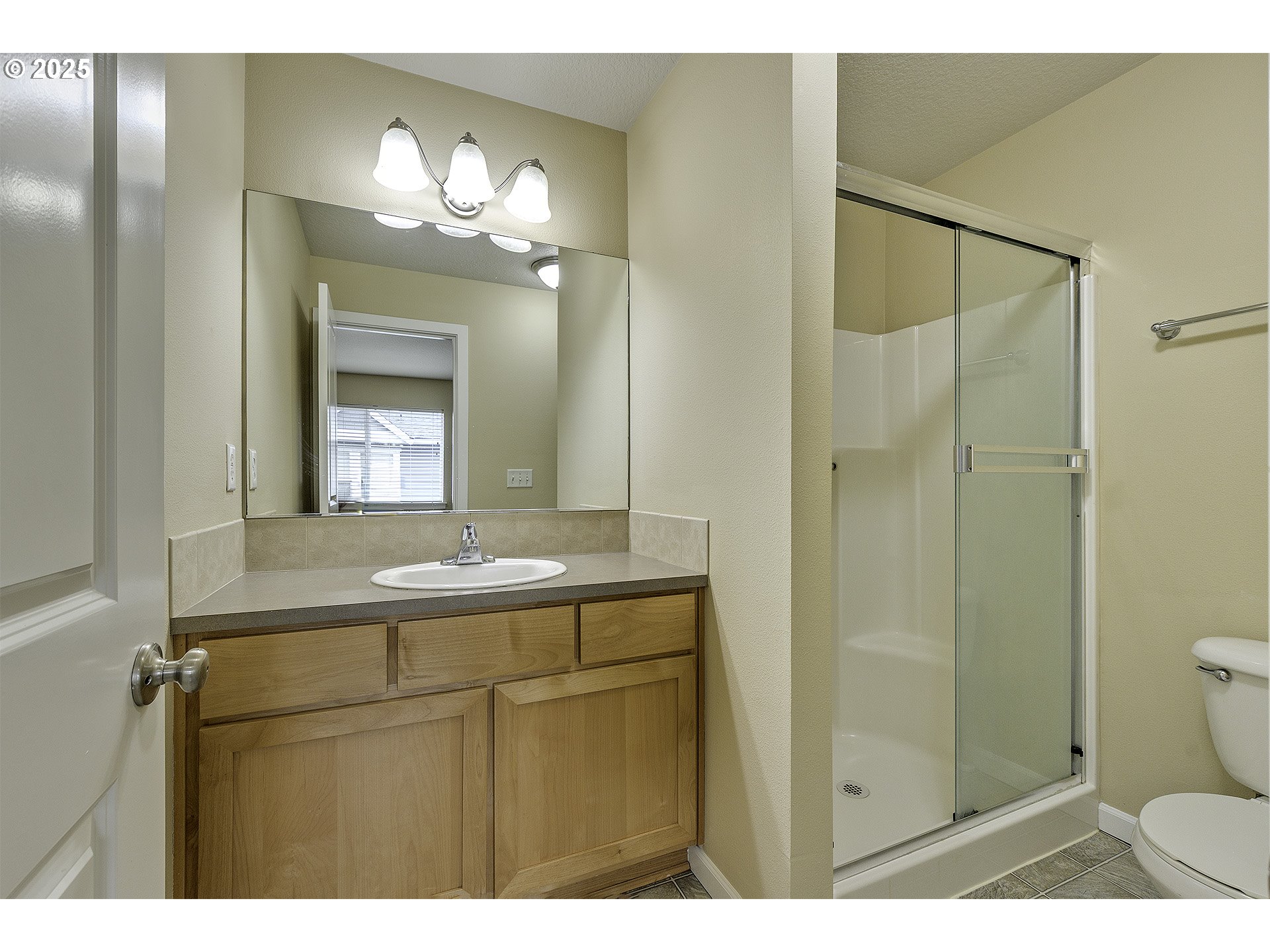 18483 Southwest Annamae Lane Beaverton, OR 97003 - Photo 17 of 23 a bathroom with a sink shower and a mirror