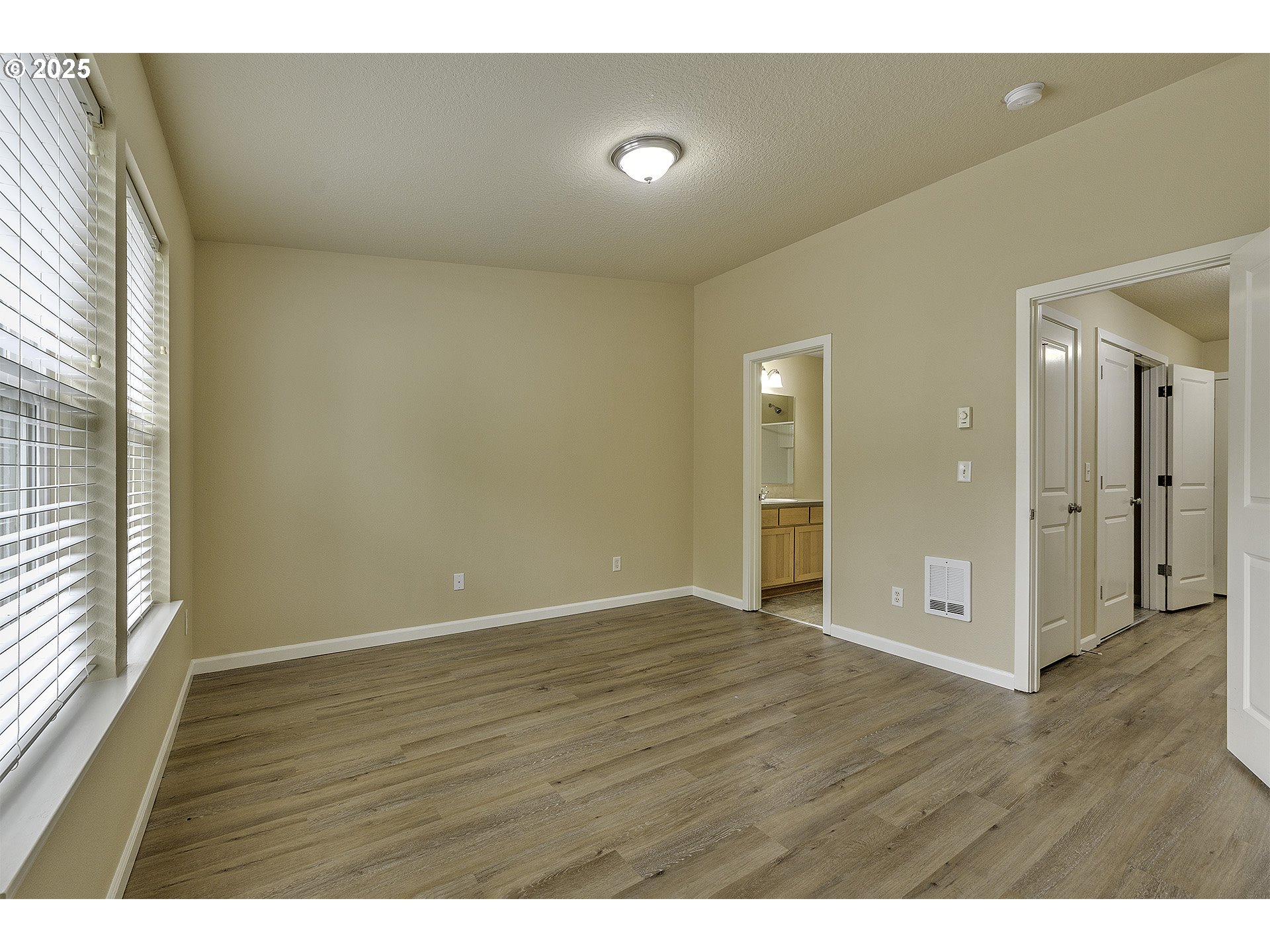 18483 Southwest Annamae Lane Beaverton, OR 97003 - Photo 19 of 23 a view of an empty room with wooden floor and a window