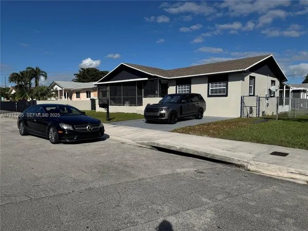 a car parked in front of a house