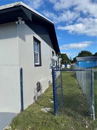 a view of an house with backyard porch and entertaining space