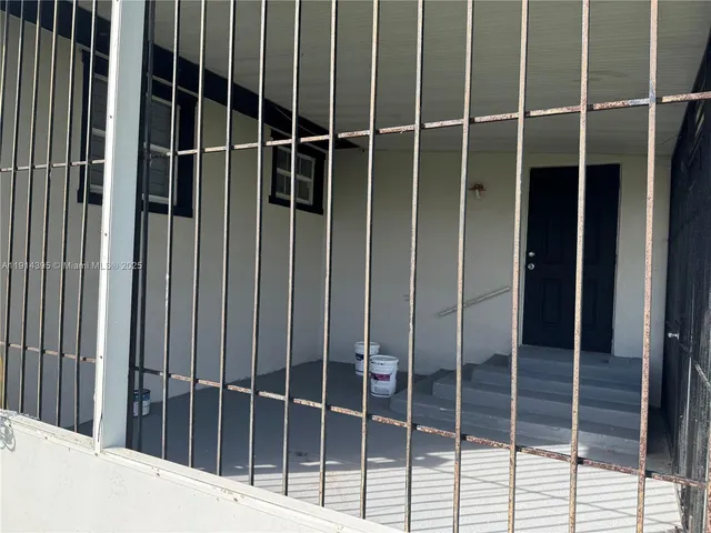a view of a house with a yard and plants