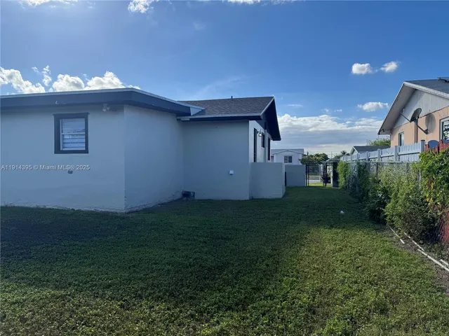 a view of balcony with wooden floor and fence
