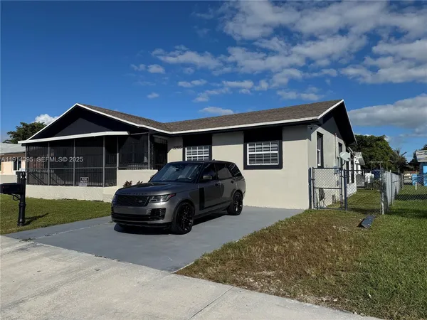 a car parked in front of a house