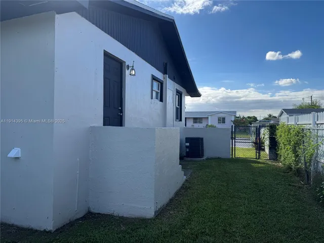 a kitchen with a sink cabinets and window
