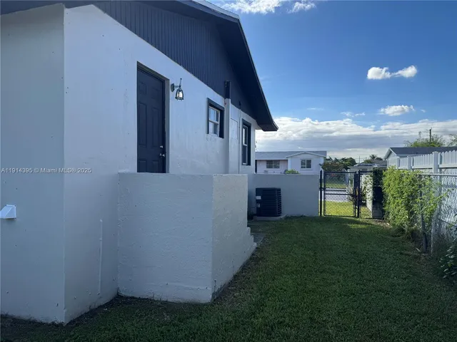 a kitchen with a sink cabinets and window