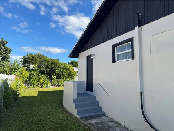 a bedroom with a bed and a ceiling fan
