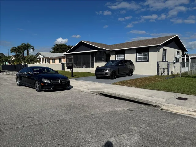 a car parked in front of a house