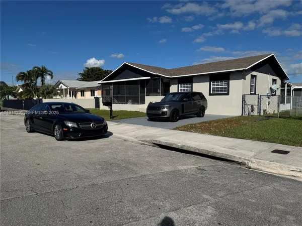 a car parked in front of a house