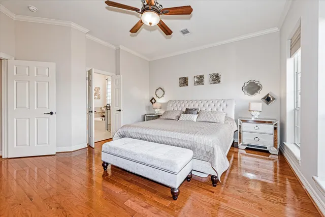 a spacious bathroom with a double vanity sink a mirror a bathtub and next to a window
