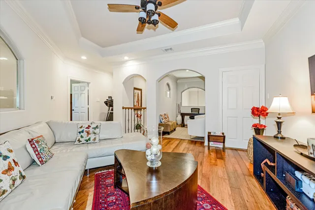 a living room with furniture and a mirror