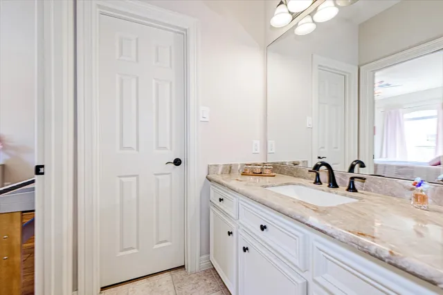 a bed room with a bed and a chandelier