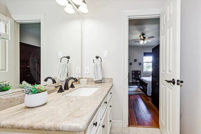 a white toilet sitting next to a bathroom sink