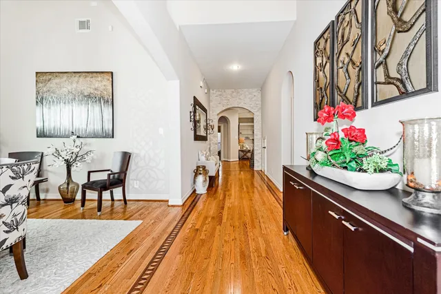 a living room with furniture and flowers
