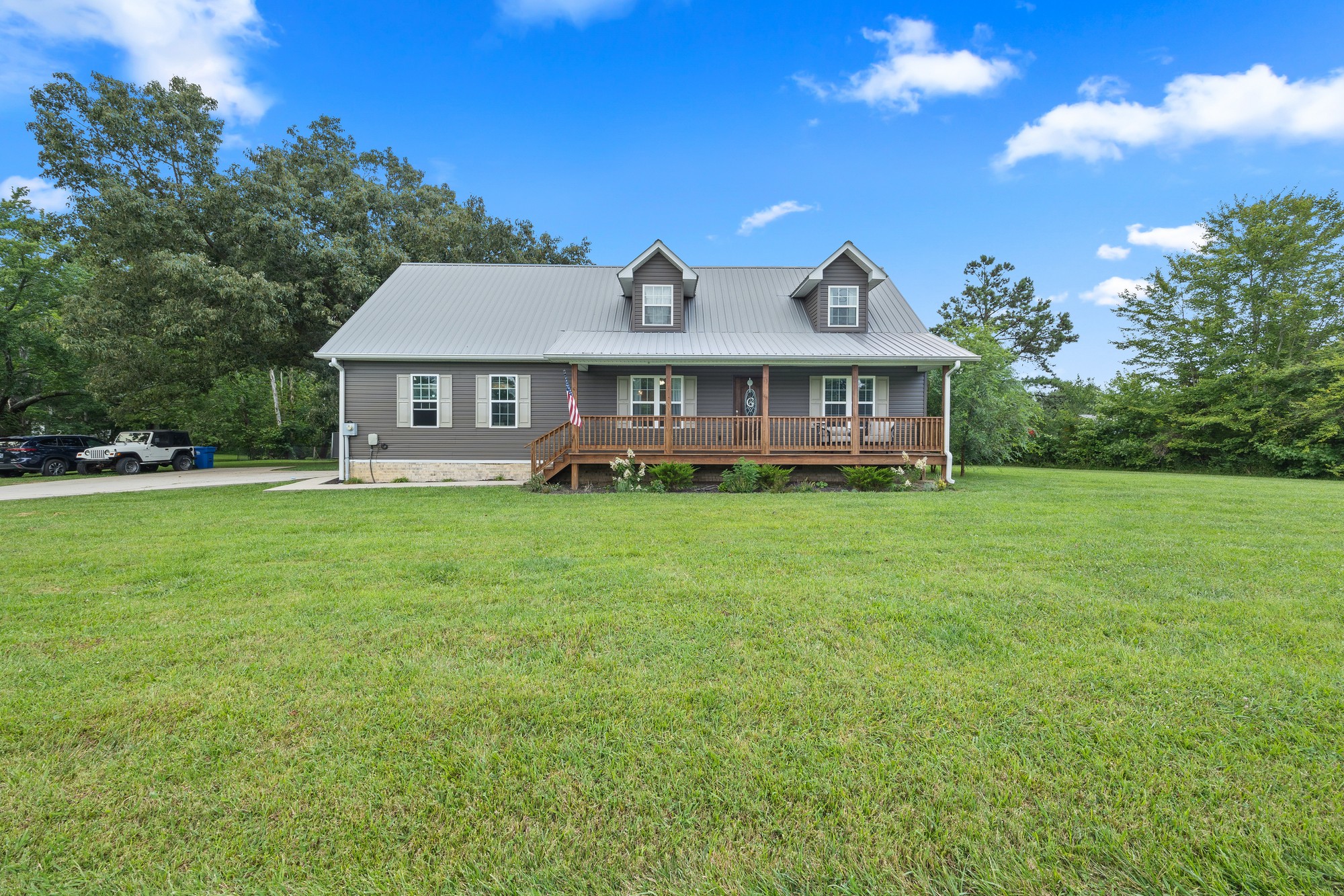 2195 Elmore Town Road Baxter, TN 38544 - Photo 1 of 26 a front view of a house with garden