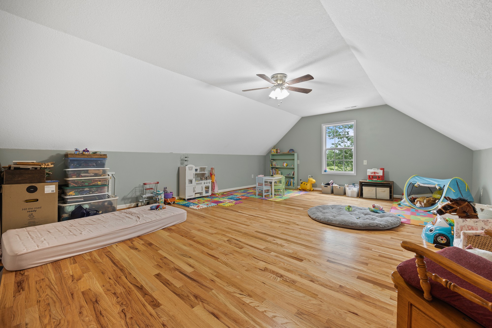 2195 Elmore Town Road Baxter, TN 38544 - Photo 14 of 26 a bed room with a bed mirror and a window
