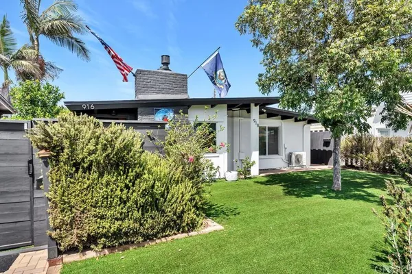 a view of a house with garden and yard