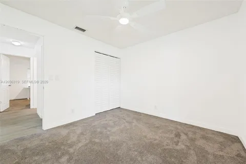 an empty room with white wall and white walls