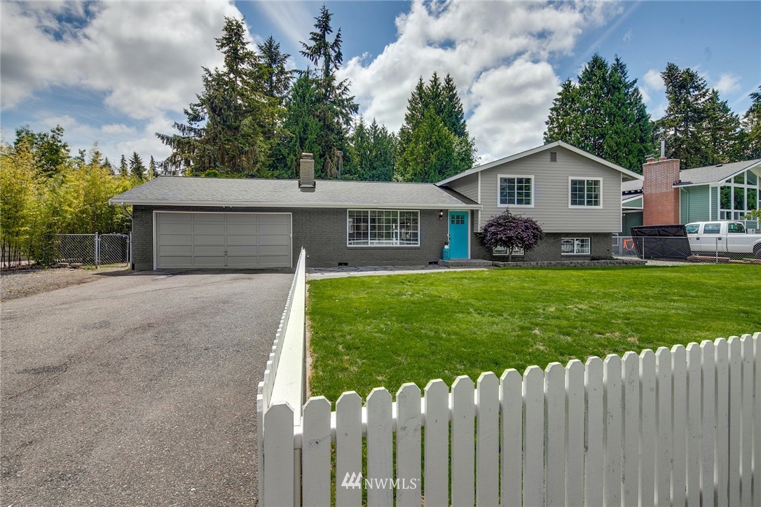 13833 Southeast 142nd Street Renton, WA 98059 - Photo 1 of 22 a front view of a house with a yard