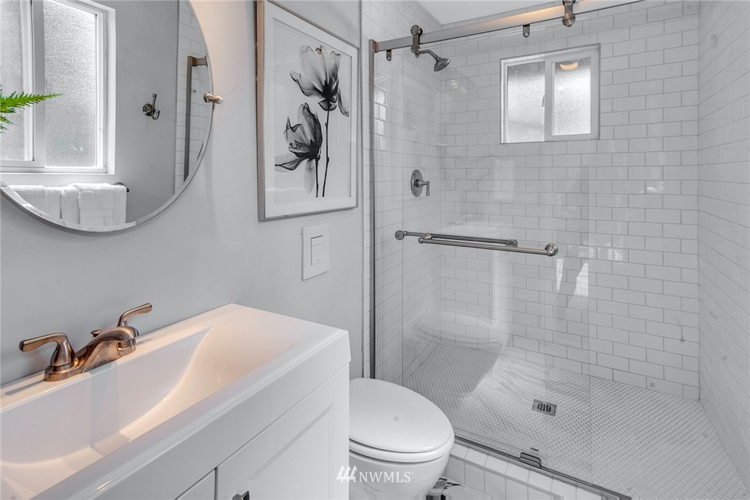 13833 Southeast 142nd Street Renton, WA 98059 - Photo 11 of 22 a bathroom with a sink toilet and shower