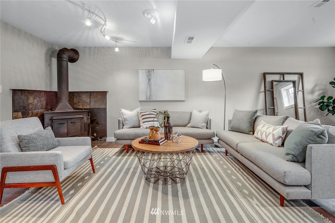 13833 Southeast 142nd Street Renton, WA 98059 - Photo 12 of 22 a living room with furniture and a wooden floor