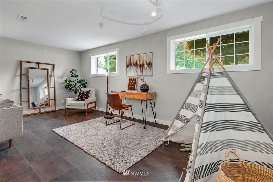 13833 Southeast 142nd Street Renton, WA 98059 - Photo 14 of 22 a living room with furniture and a wooden floor