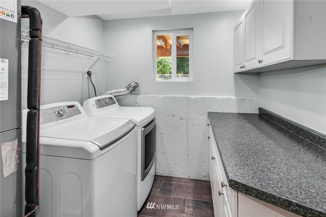 13833 Southeast 142nd Street Renton, WA 98059 - Photo 19 of 22 a utility room with dryer and washer