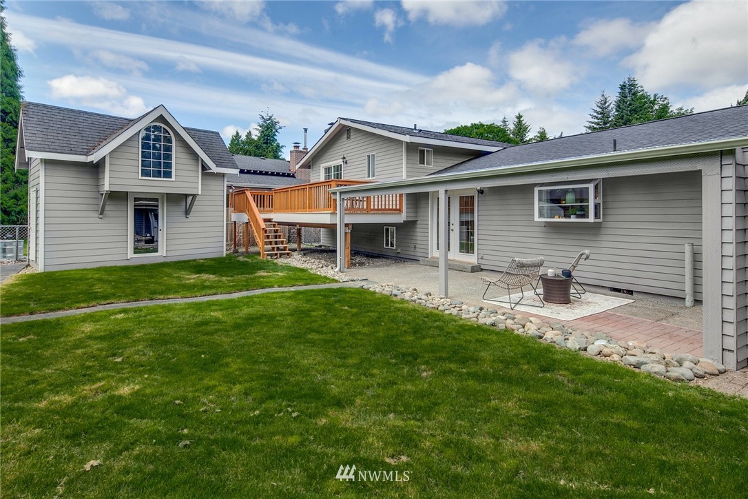 13833 Southeast 142nd Street Renton, WA 98059 - Photo 21 of 22 a front view of house with yard and green space