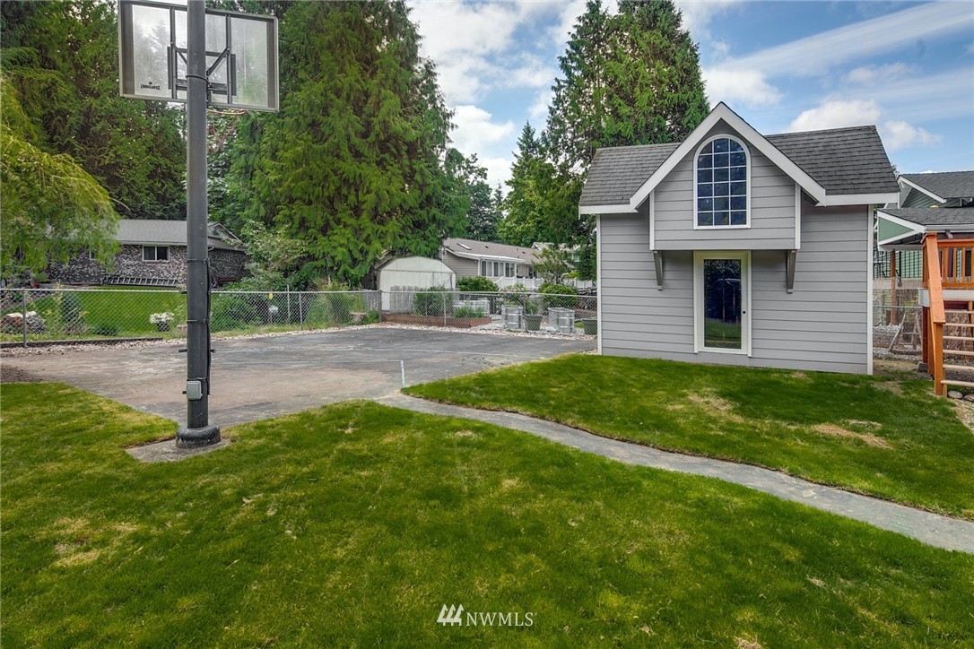 13833 Southeast 142nd Street Renton, WA 98059 - Photo 22 of 22 a front view of a house with a yard and trees