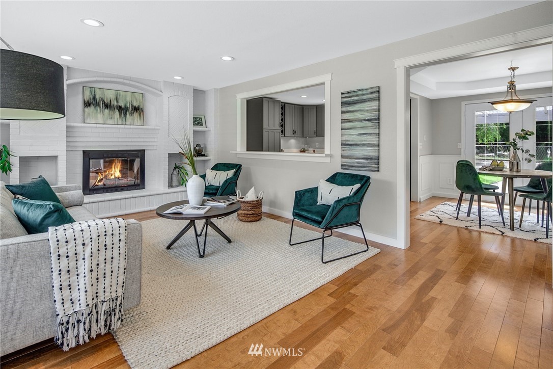 13833 Southeast 142nd Street Renton, WA 98059 - Photo 4 of 22 a living room with furniture and a fireplace