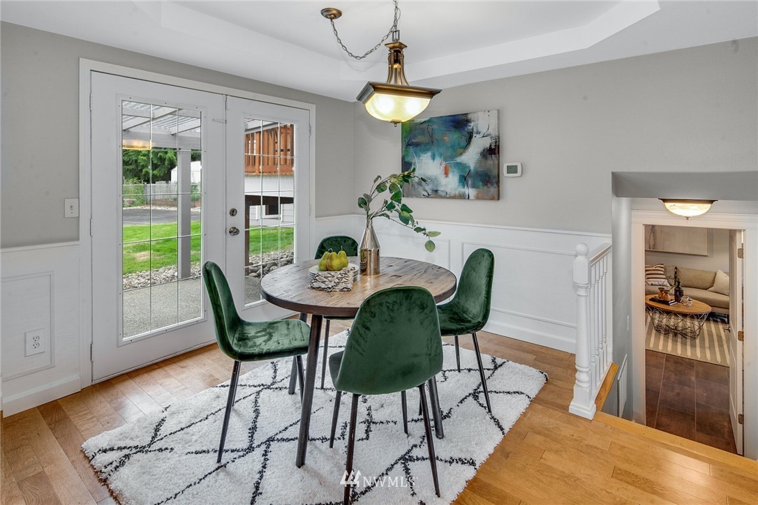 13833 Southeast 142nd Street Renton, WA 98059 - Photo 6 of 22 a view of a dining room with furniture and wooden floor