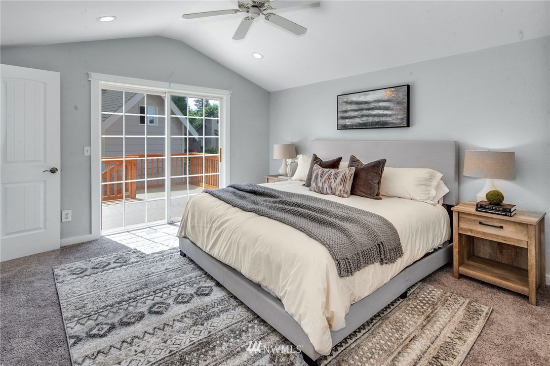 13833 Southeast 142nd Street Renton, WA 98059 - Photo 10 of 22 a bedroom with a large bed and a window