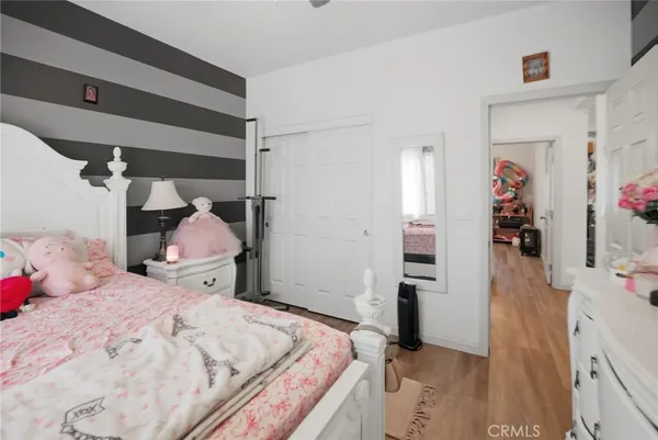 a bed room with a bed and a walk in closet