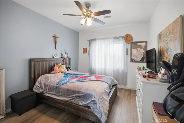 a bedroom with a bed and a dresser