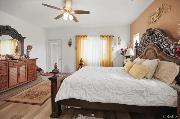 a bedroom with a bed and dresser