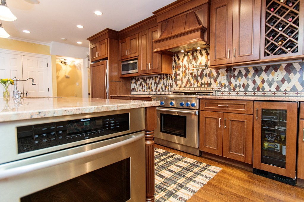 61 Windsor Road Wellesley, MA 02481 - Photo 9 of 30 a kitchen with stainless steel appliances granite countertop a stove and a sink
