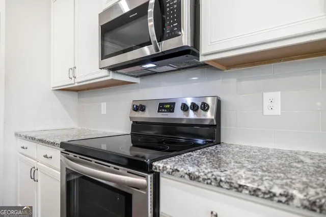 a bathroom with a sink toilet tub and shower