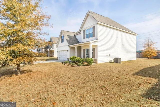a front view of a house with a yard