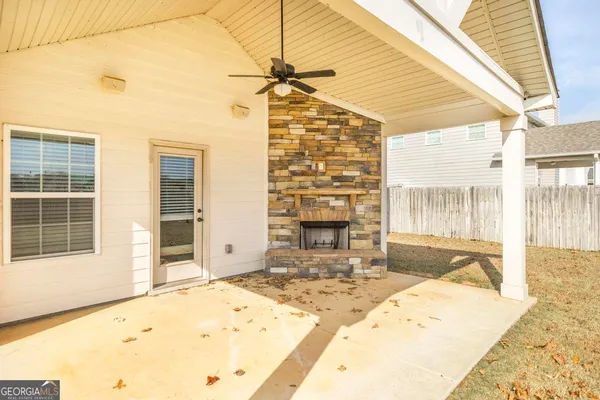 a view of a house with a yard and balcony
