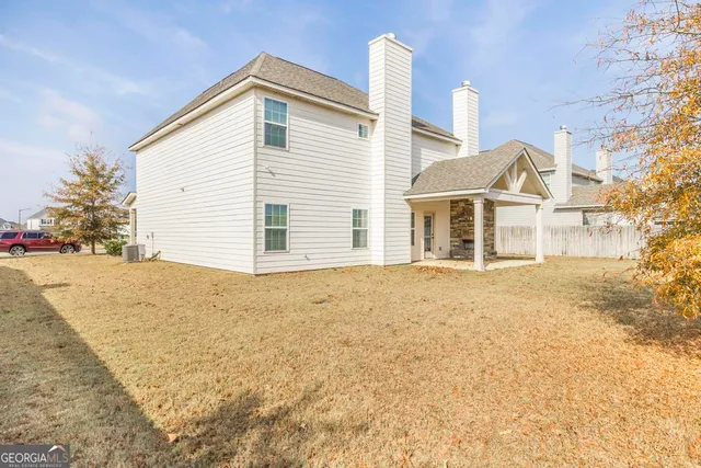 a house with trees in front of it