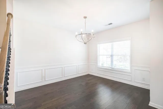 a view of a kitchen with a stove cabinets and wooden floor
