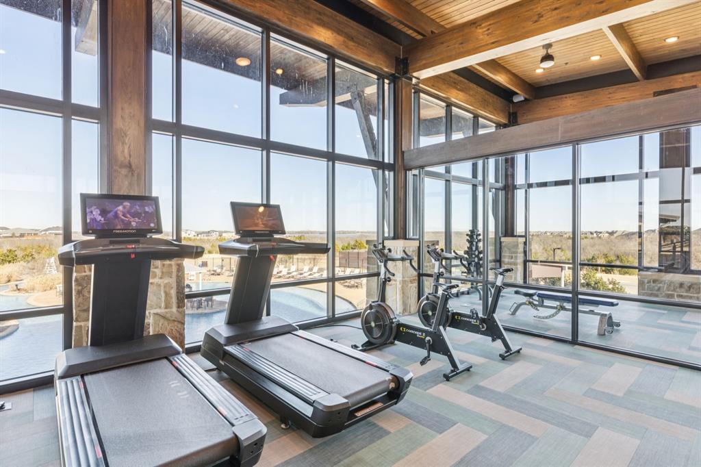 2011 April Dew Way Wylie, TX 75098 - Photo 14 of 20 a room with gym equipment and large windows