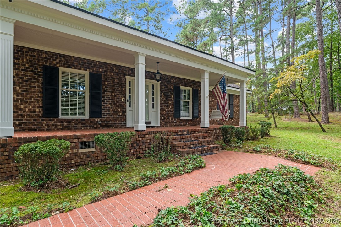 610 Maynard Lake Road Erwin, NC 28339 - Photo 47 of 49 a front view of a house with garden